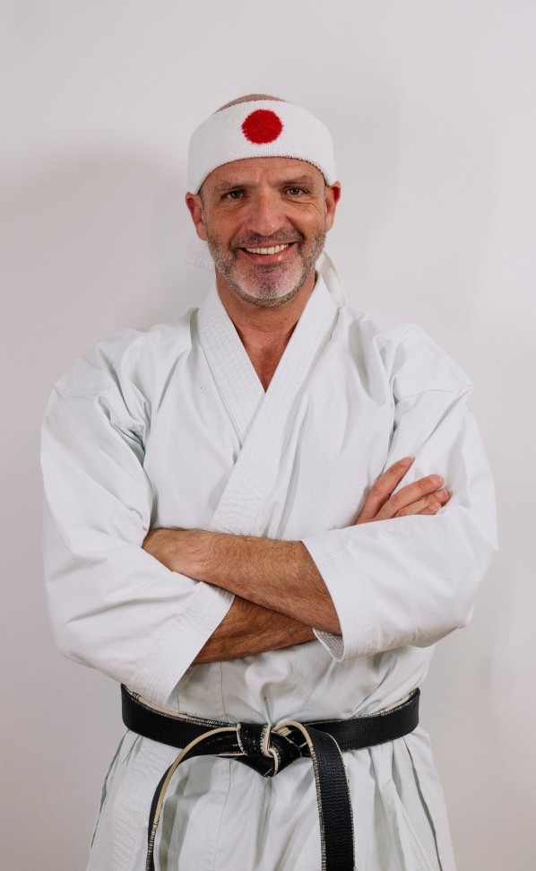 A sensei calmly practicing karate, since Mokuso is doing the hard work.